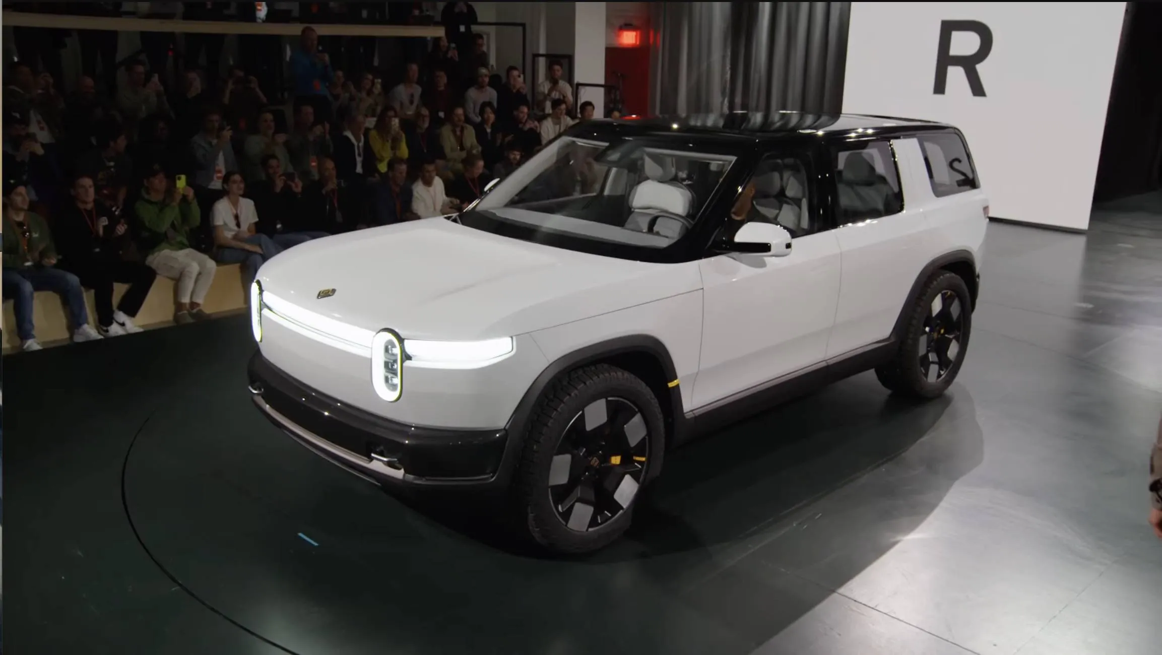 Rivian R2 priced at $45,000, range over 300 miles, 0-60 in under 3.0 seconds.